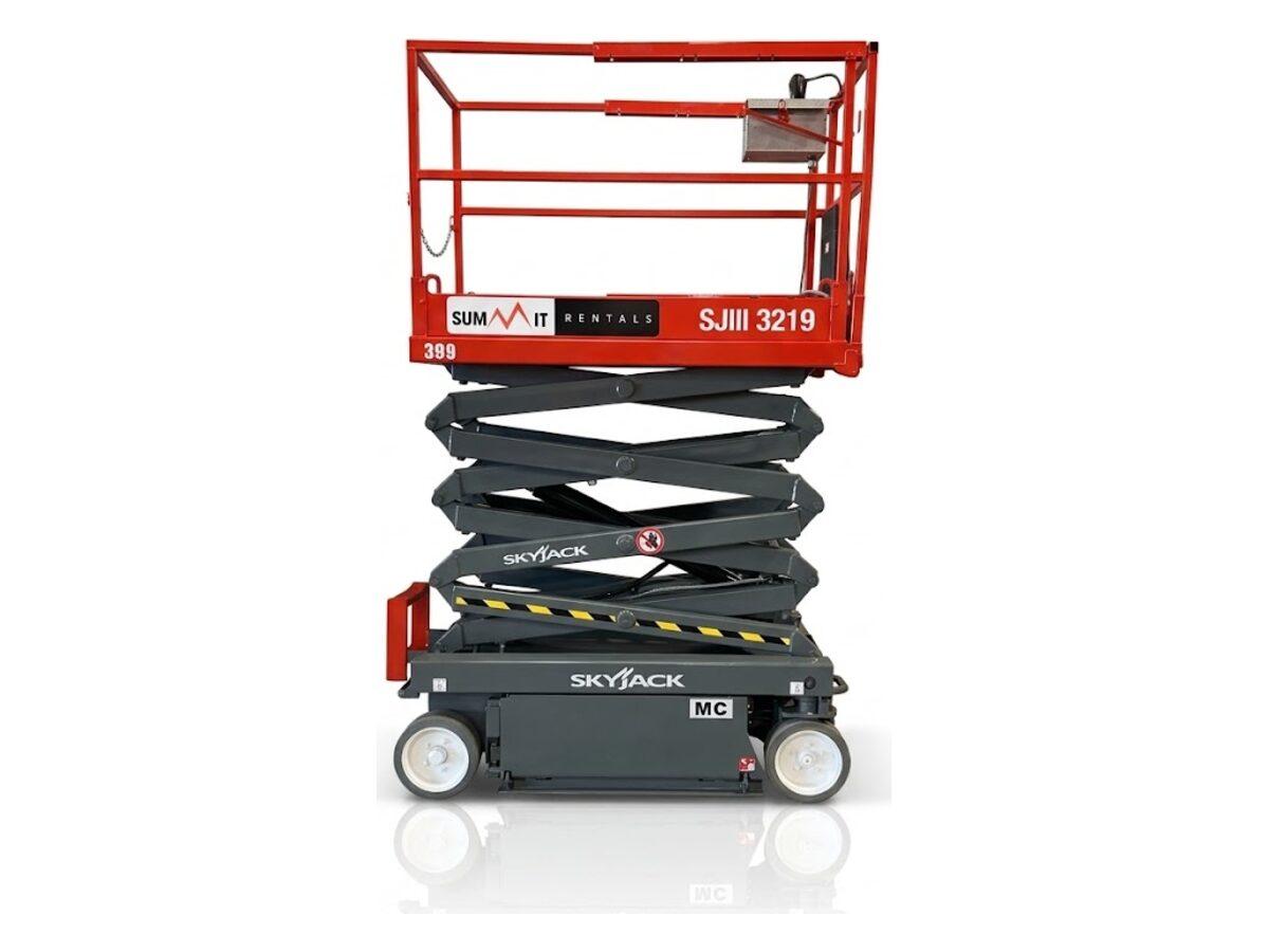 Skyjack SJIII 3219 electric scissor lift raised to full height, with non-marking tires for finished floors in Phoenix-area buildings