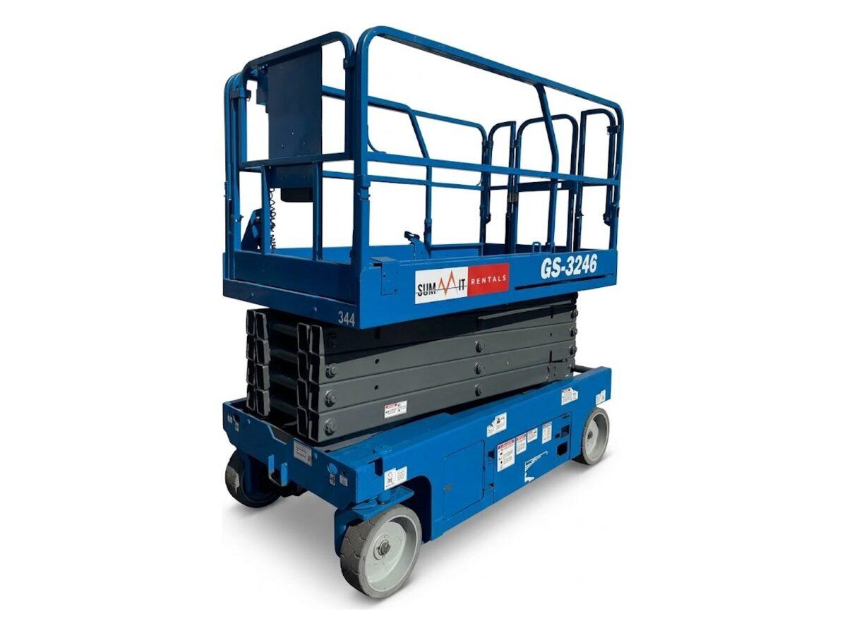 Genie GS-3246 electric scissor lift with the platform lowered, showing the 46 in wide chassis and 700 lb deck