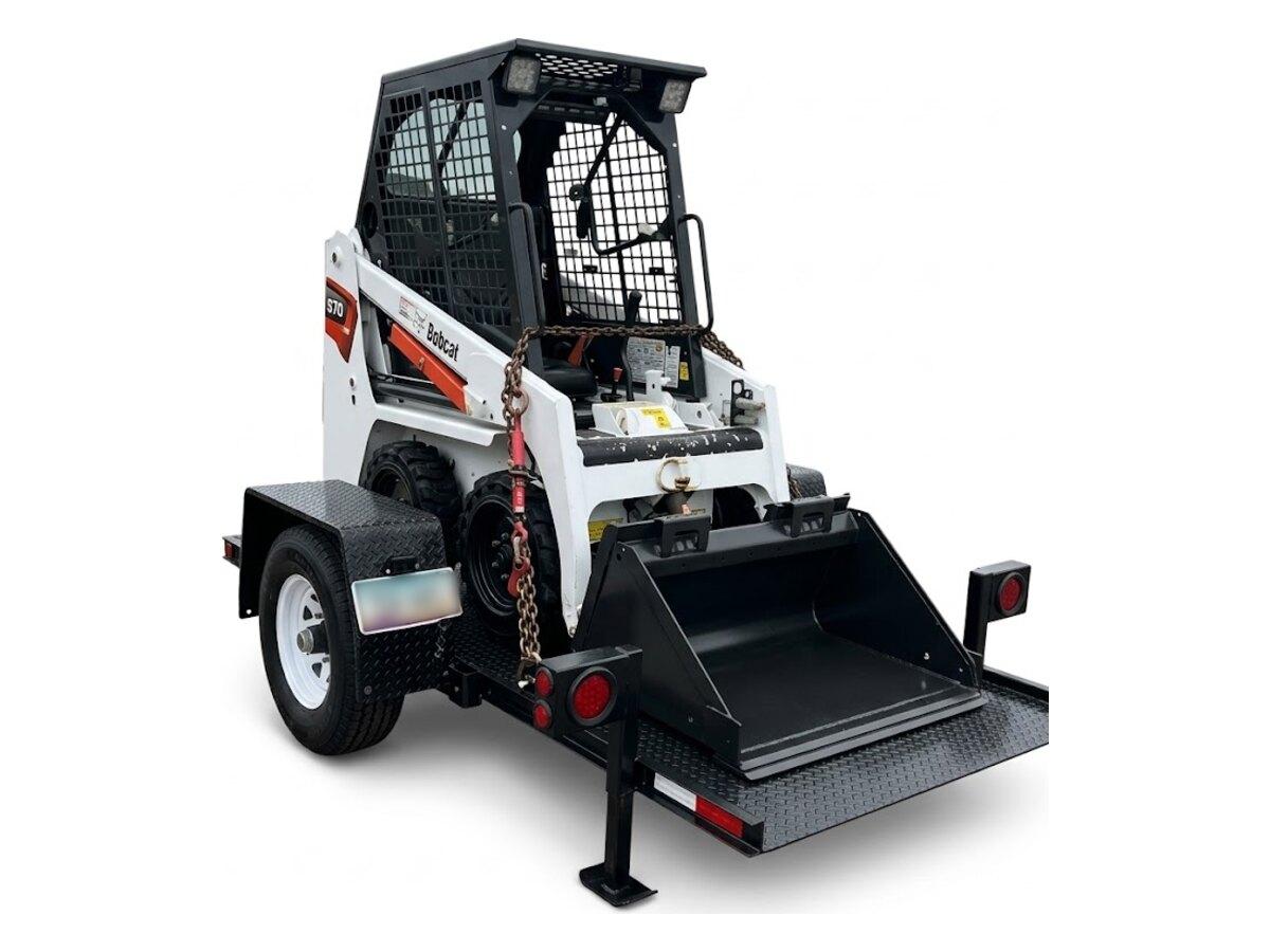 10 ft single axle tilt deck trailer carrying a Bobcat S70 skid steer, for rent from Summit Rentals in Phoenix, AZ
