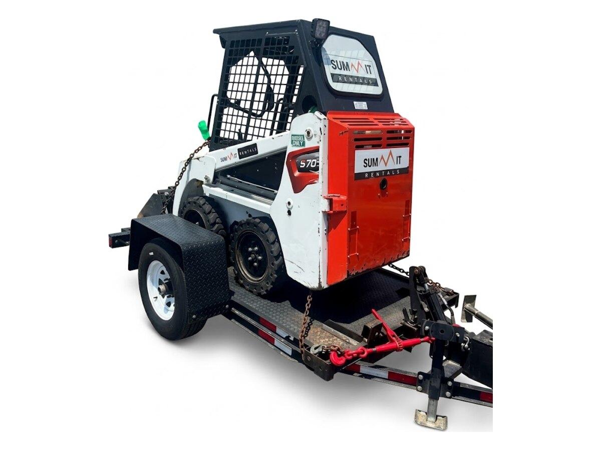 Bobcat S70 chained down on the 10 ft tilt deck trailer, ready to tow with a 2 in ball across the Phoenix valley