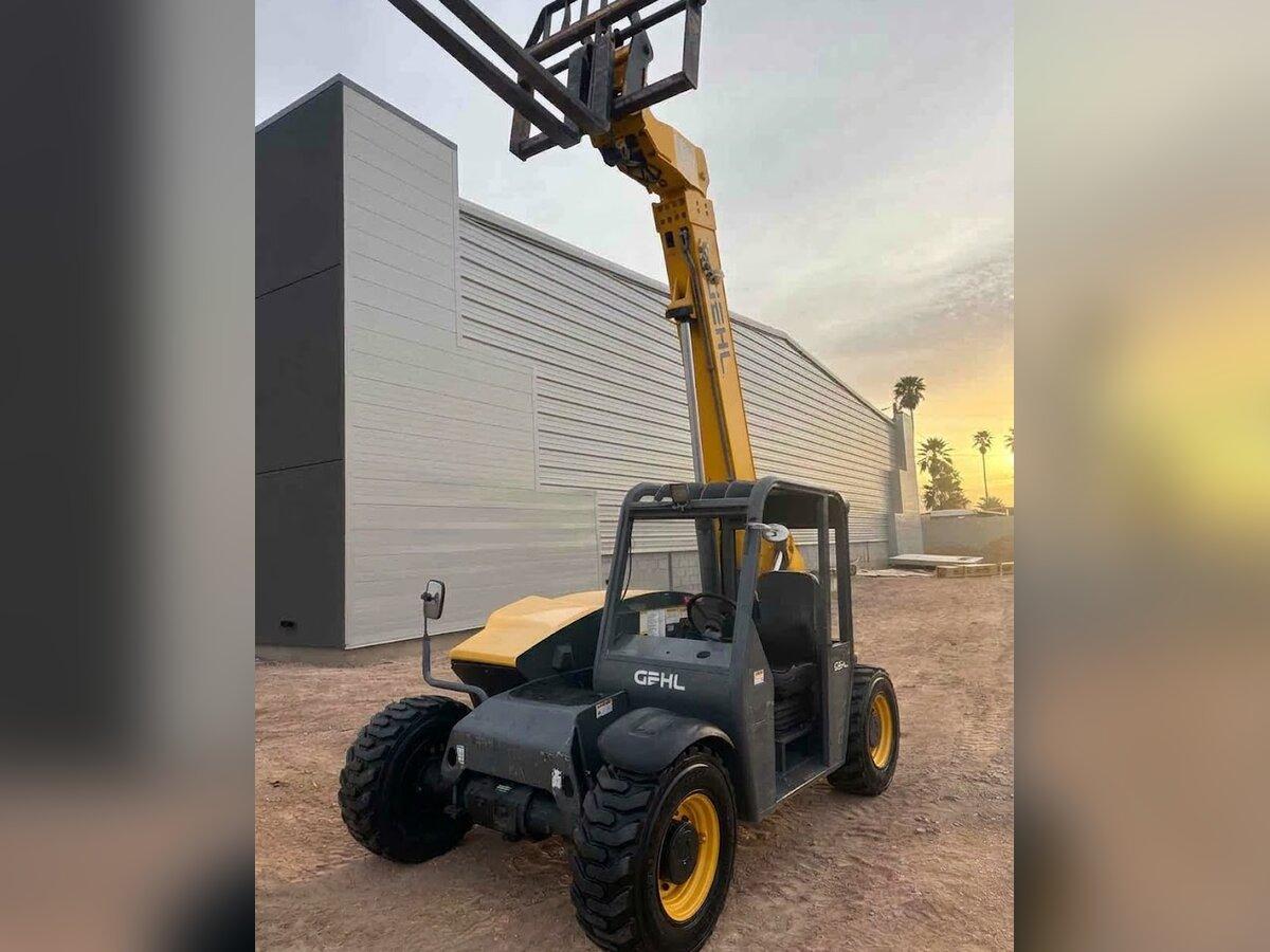 Gehl compact telehandler rental delivered early in the morning by Summit Rentals to a commercial building site in Apache Junction, AZ