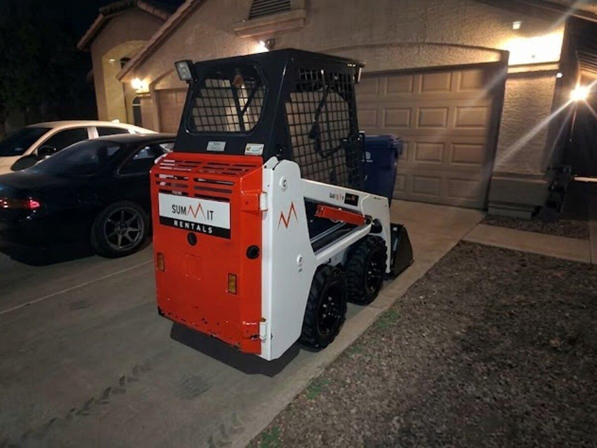 Bobcat S70 700 lb skid steer rental delivered early in the morning by Summit Rentals to a home driveway in Avondale, AZ