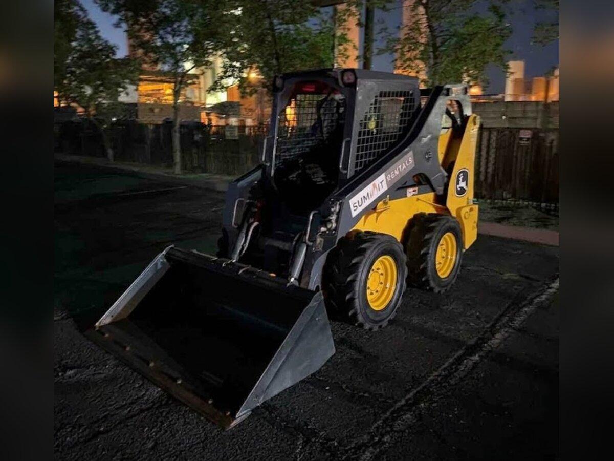 John Deere 318G skid steer rental delivered early in the morning by Summit Rentals to a commercial job site in Chandler, AZ
