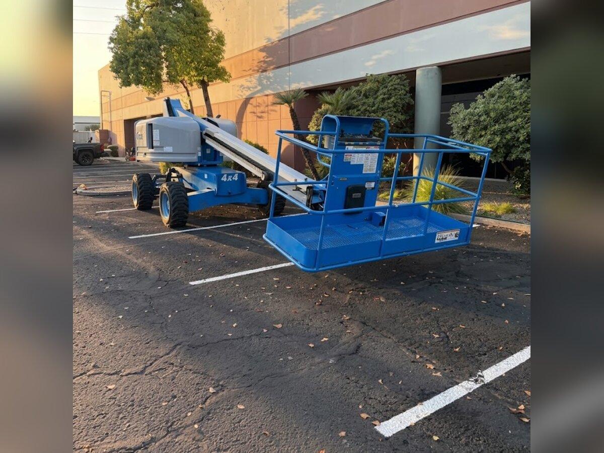 Genie S-40 straight boom lift rental delivered early in the morning by Summit Rentals to an office park parking lot in Chandler, AZ