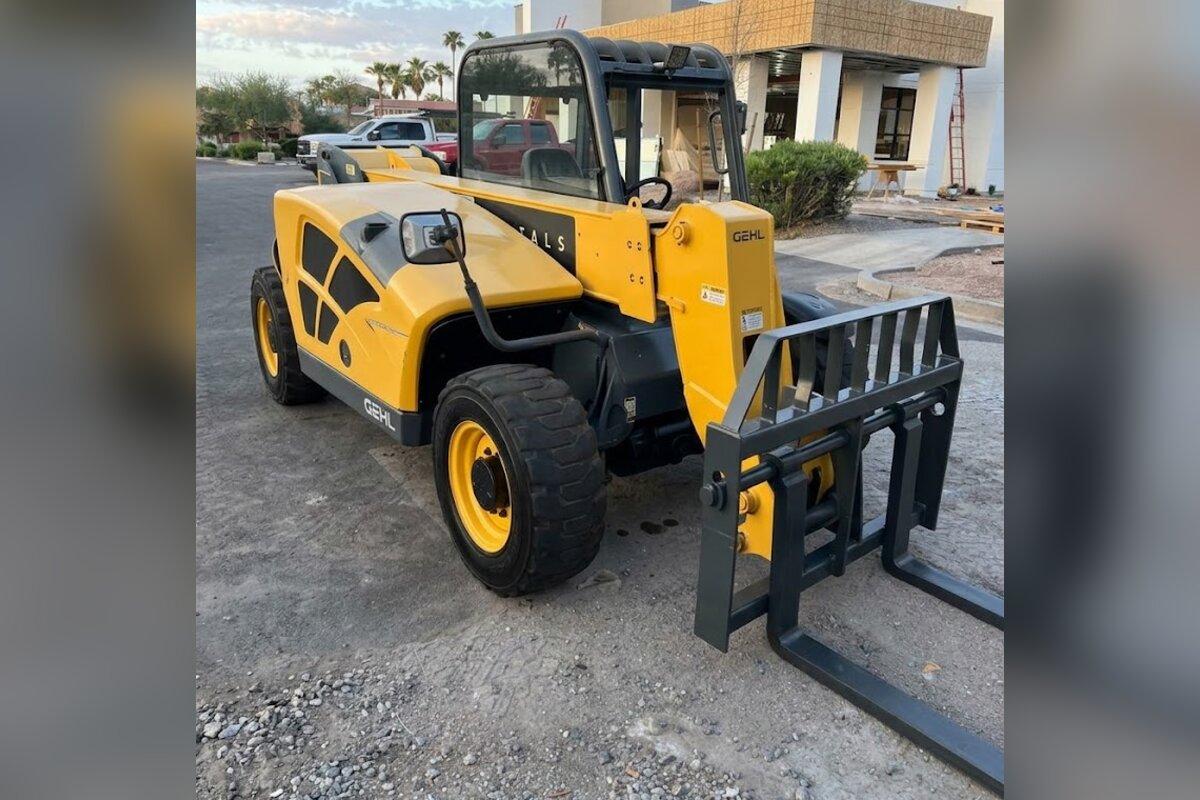 Gehl compact telehandler rental with pallet forks delivered early in the morning by Summit Rentals to a commercial remodel in Chandler, AZ