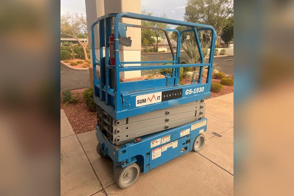 Summit Rentals Genie GS-1930 19 ft electric scissor lift delivered to an office building entrance in Glendale, AZ