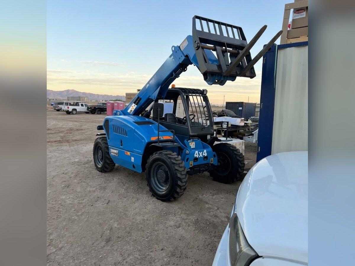 Genie GTH-5519 telehandler rental with pallet forks delivered early in the morning by Summit Rentals to a construction site in Goodyear, AZ