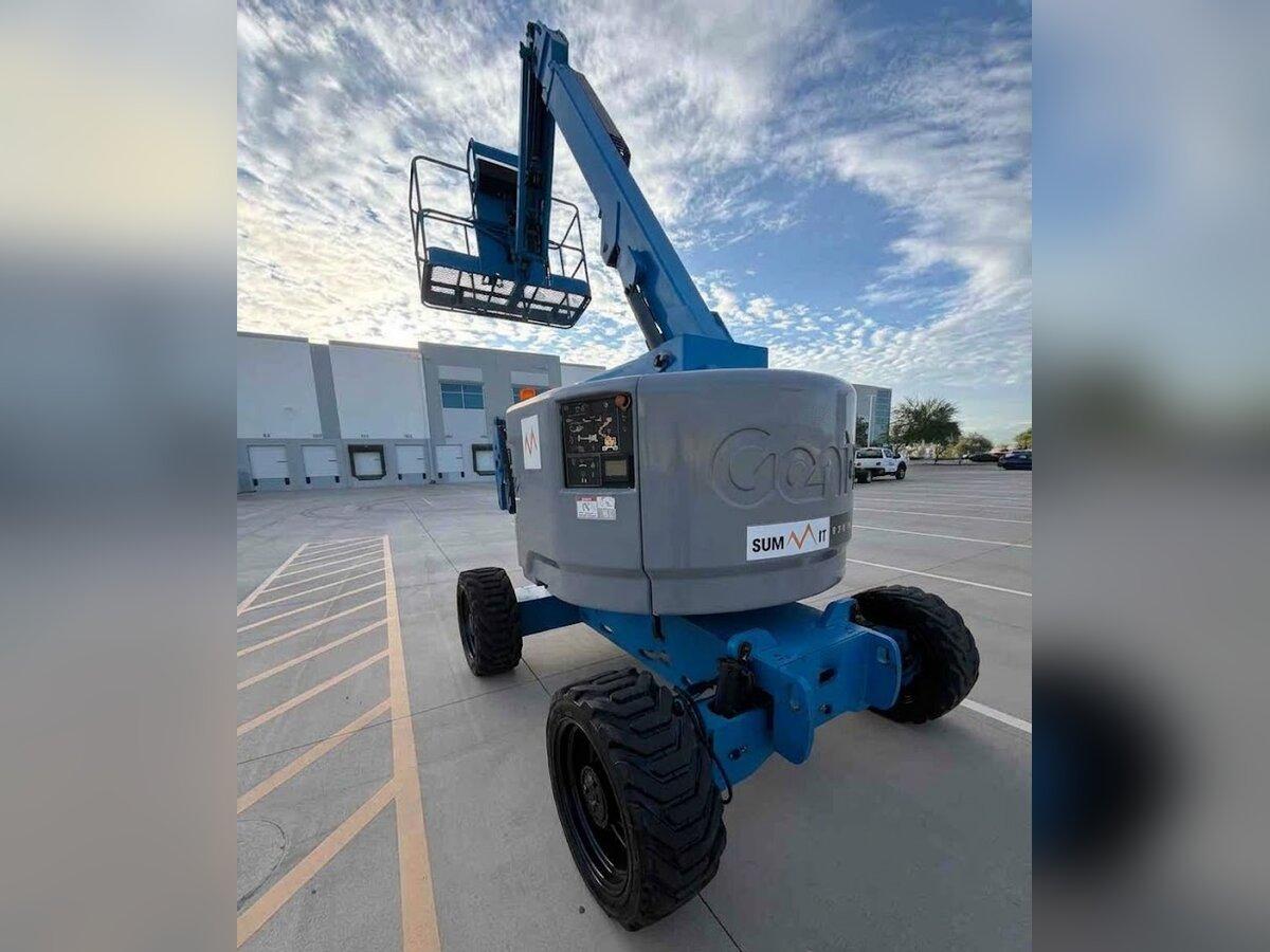Genie Z-45/25J articulating boom lift rental delivered by Summit Rentals to a distribution warehouse in Goodyear, AZ