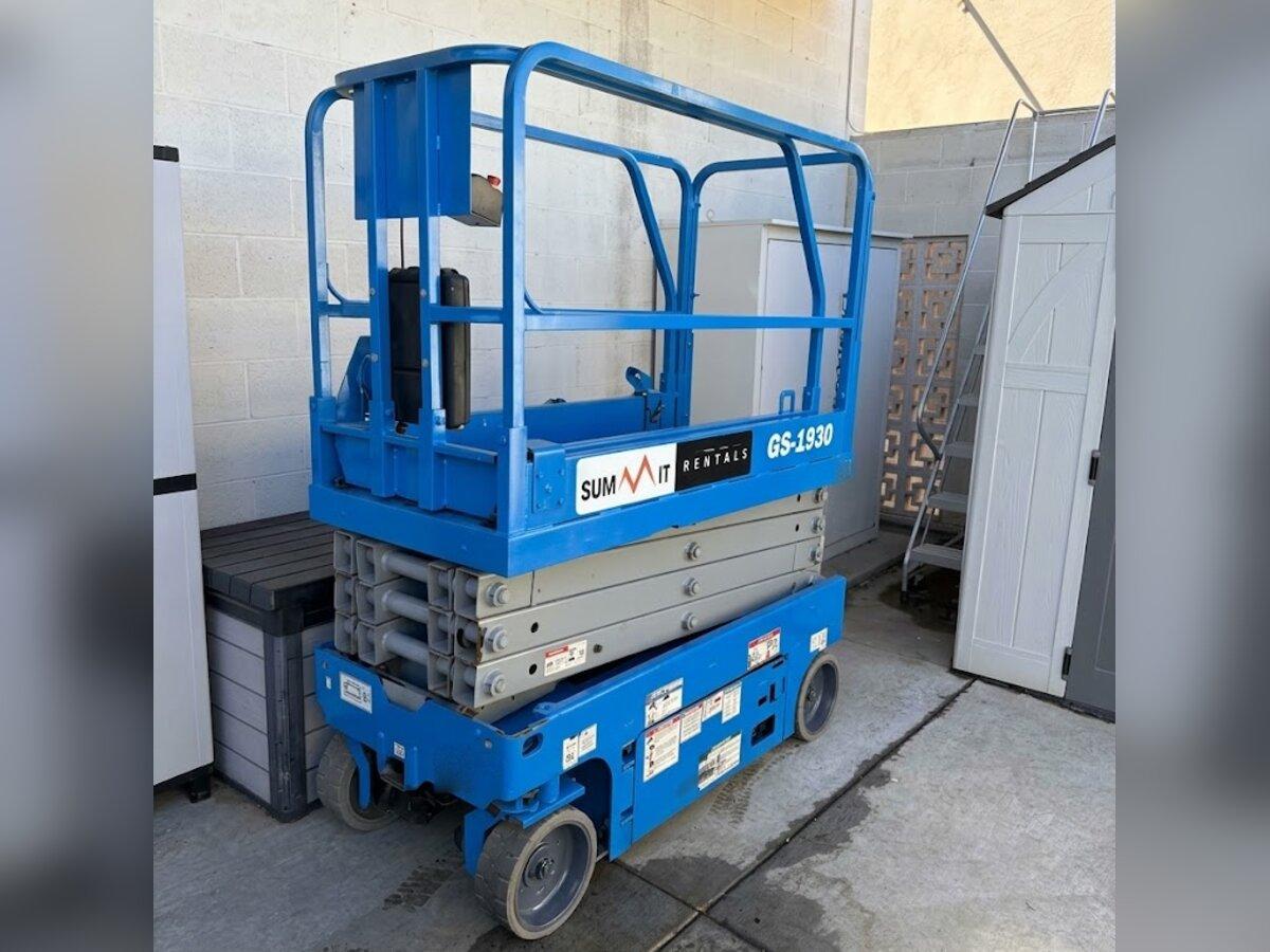 Summit Rentals Genie GS-1930 19 ft electric scissor lift delivered to a commercial building service area in Peoria, AZ