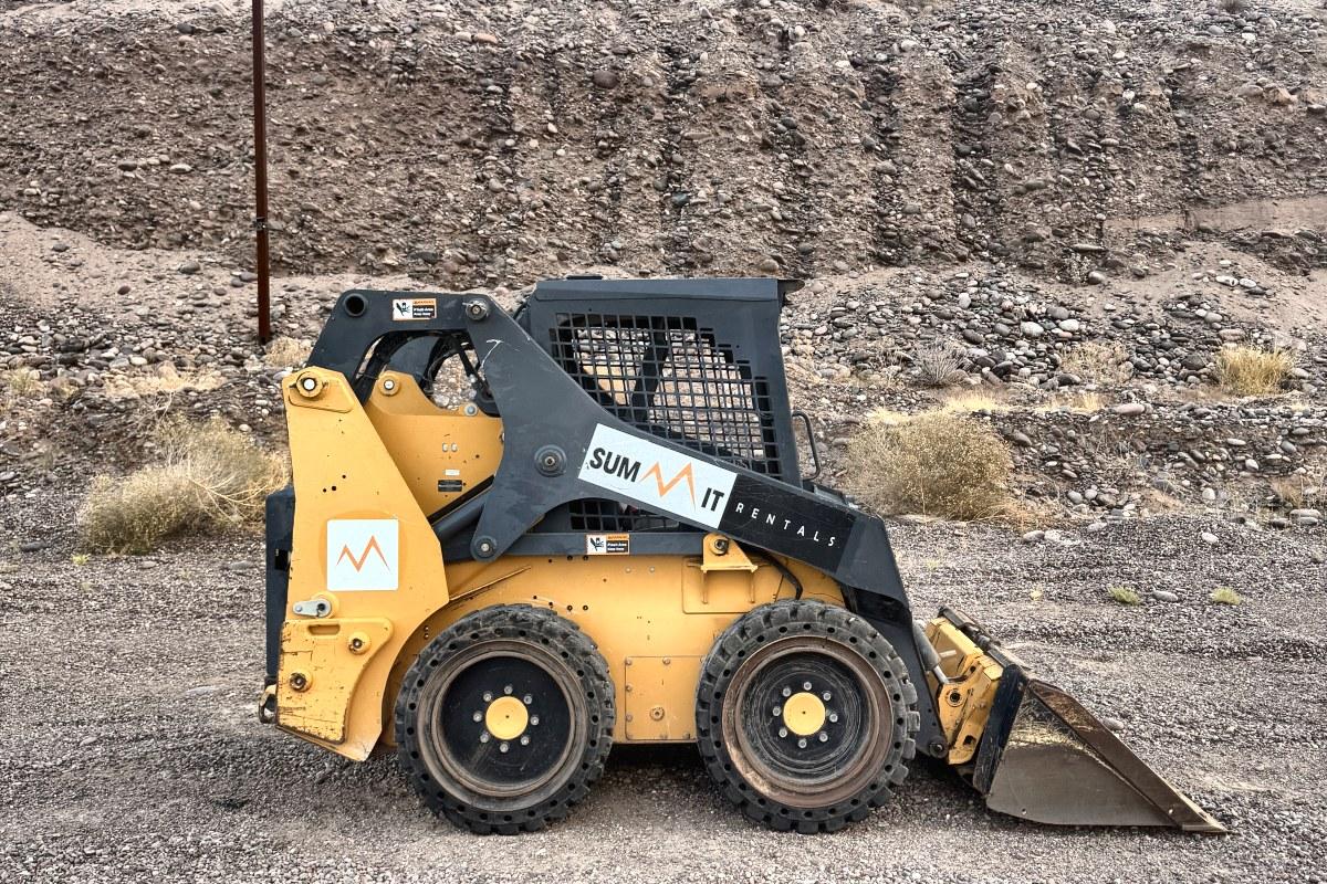John Deere 318G skid steer rental delivered by Summit Rentals to a residential lot in Surprise, AZ